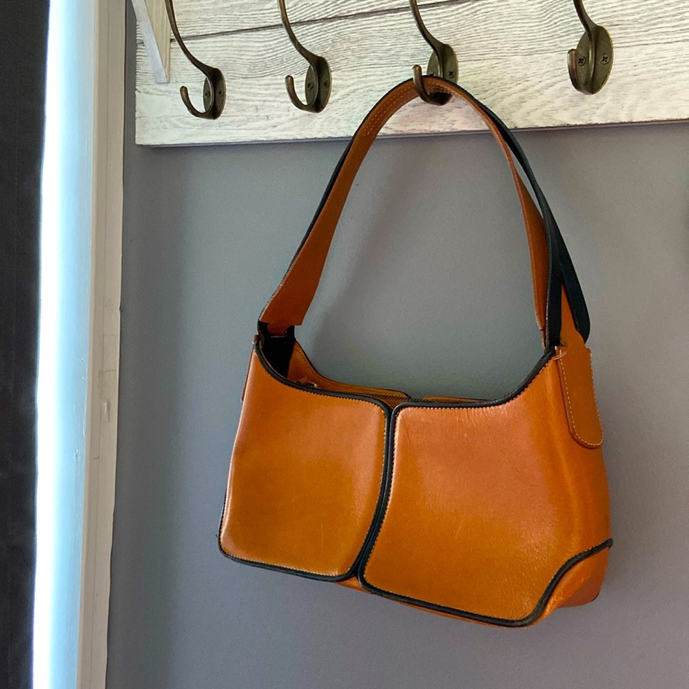 Tod’s Vintage, over the shoulder bag.
